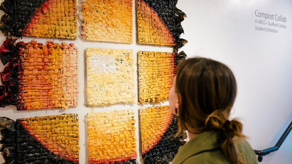 UNCG student looks at artwork in GPS