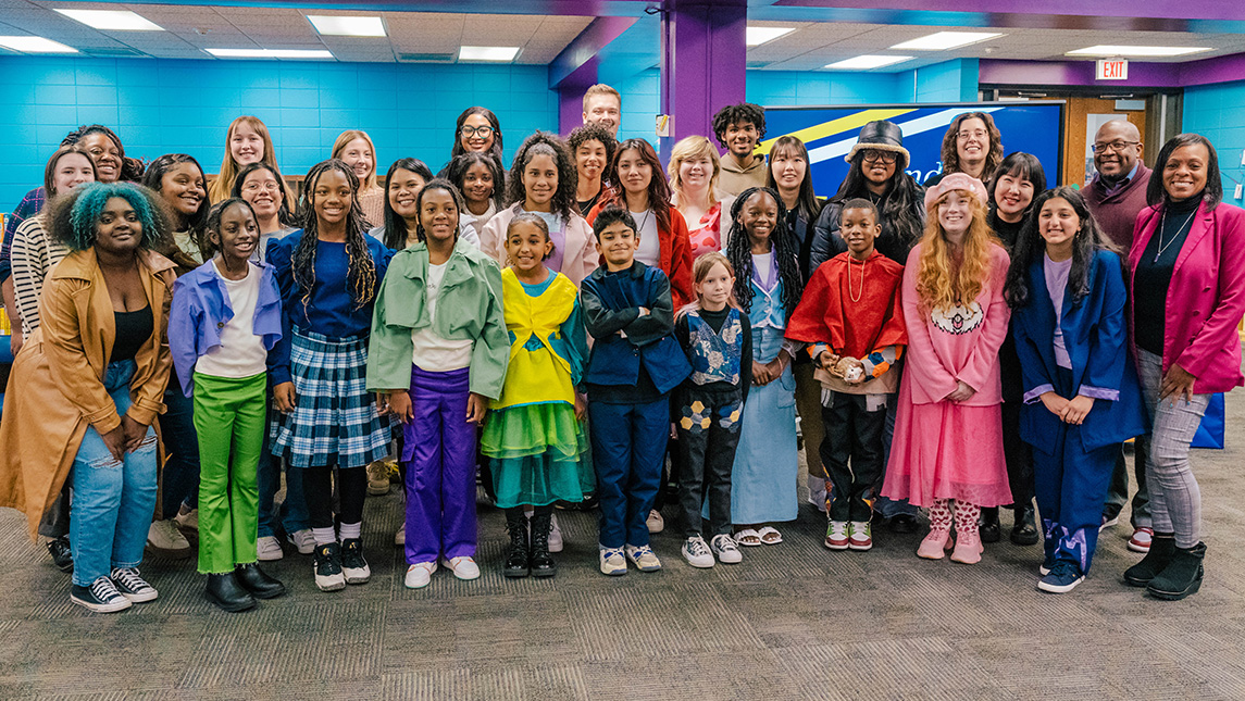 The students of Oak View Elementary and UNCG Consumer, Apparel, and Retail Studies department pose for a group photo.