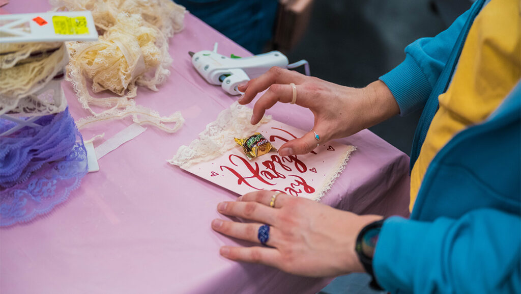A UNCG student makes a valentine.