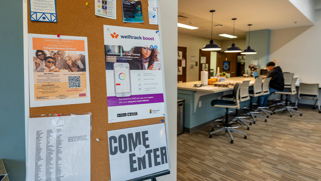 Student works at common table.