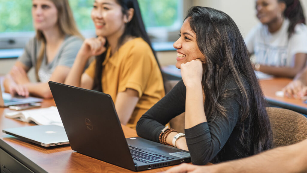 Student smiles in class