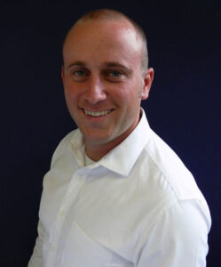 Headshot of William Adams.