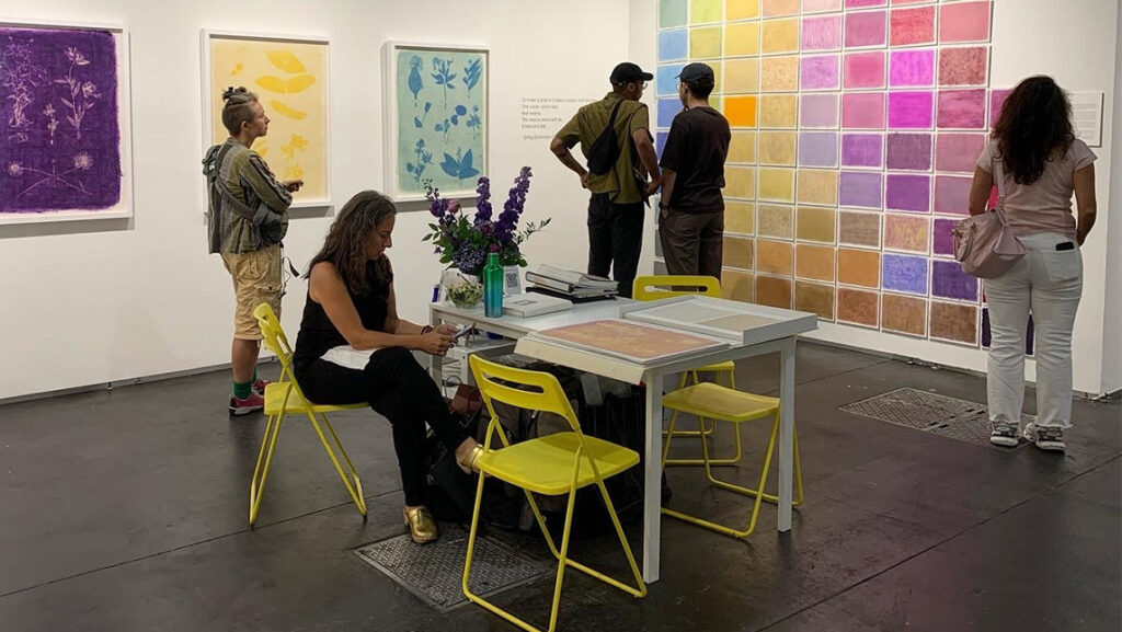 Exhibition of anthotype flower displays using Emily Dickinson herbarium.