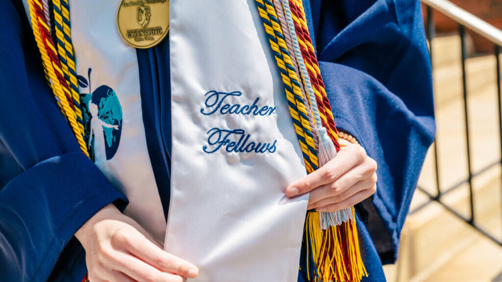 Hannah Ward shows her Teaching Fellows sash