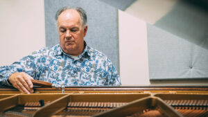 UNCG's piano technician Stephen Duncan tunes a piano.