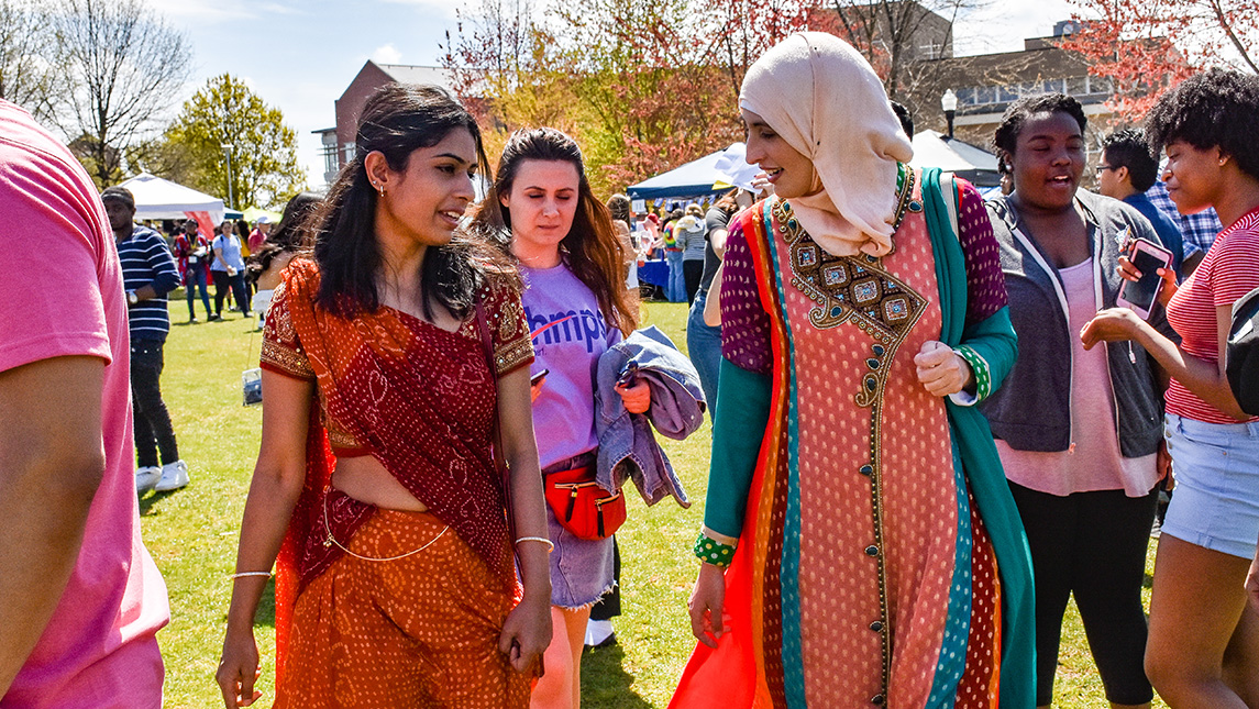 Two women in cultural dress at UNCG International Festival.