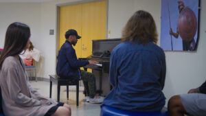 UNCG student Justin Logan plays for students in Moran Commons.