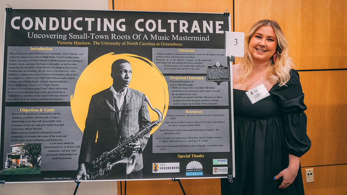 Victoria Henshaw stands with her poster at the 12th annual Graduate Research Showcase