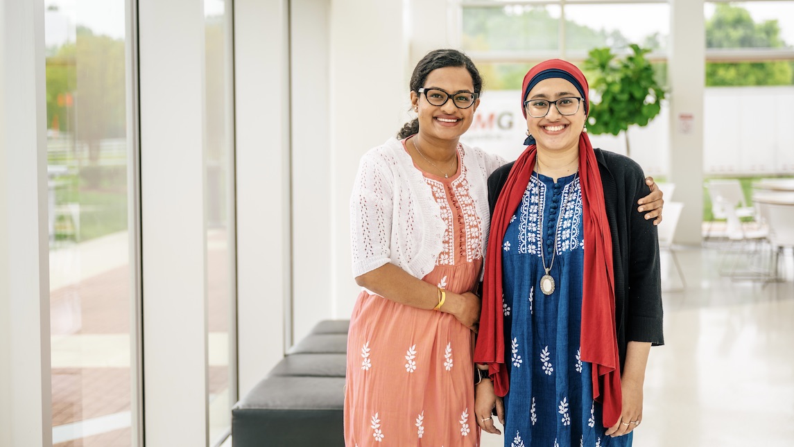 Two JSNN students posing in UNCG building.