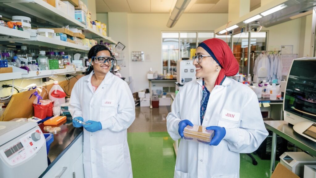 Two JSNN students in the UNCG lab working.