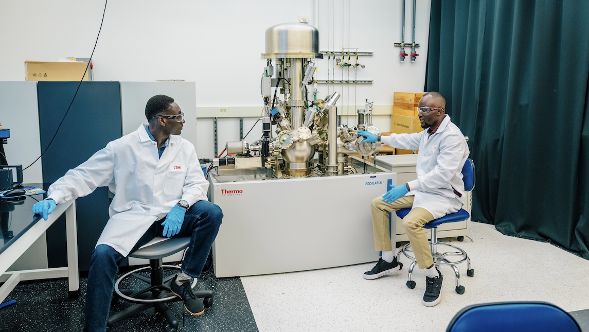Two JSNN students sitting in chairs in the lab at UNCG.