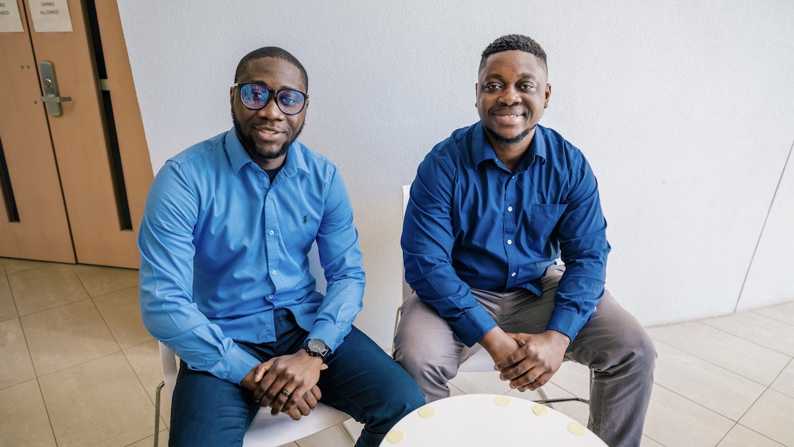 Two JSNN students take a moment to smile for the camera in UNCG building.