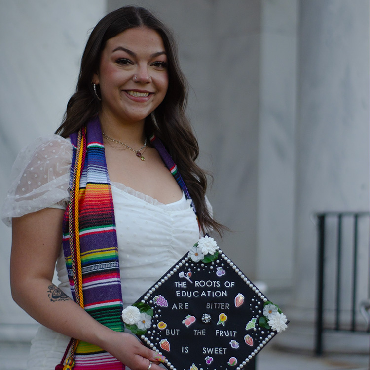 UNCG 2024 grad Ayana Cholula shows off her decorated graduation cap.