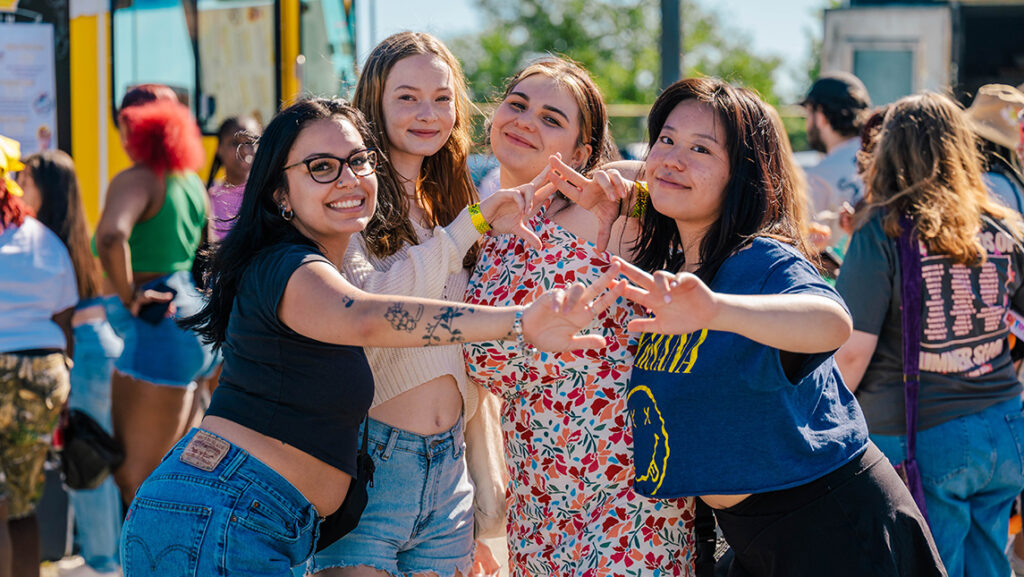 UNCG students enjoy a nice day on campus with food trucks.