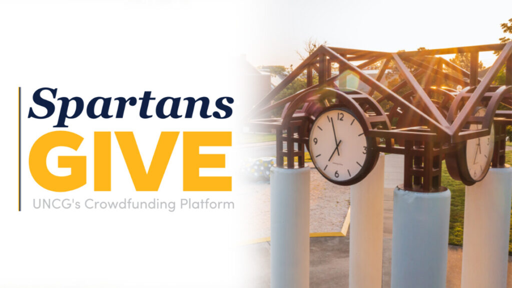 UNCG clocktower next to the logo for Spartans Give.