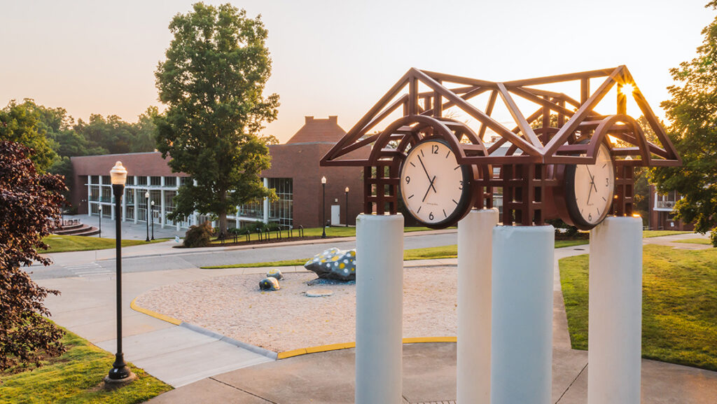 Sun sets behind the UNCG clock tower.
