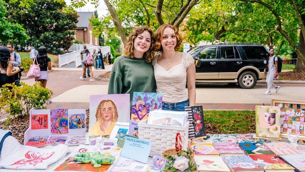Students showcasing their art at the student marketplace.