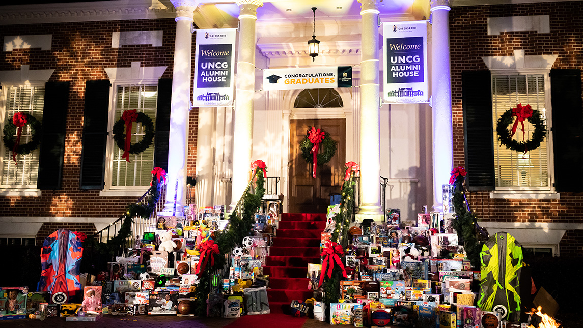 Presents piled around the UNCG Alumni House.
