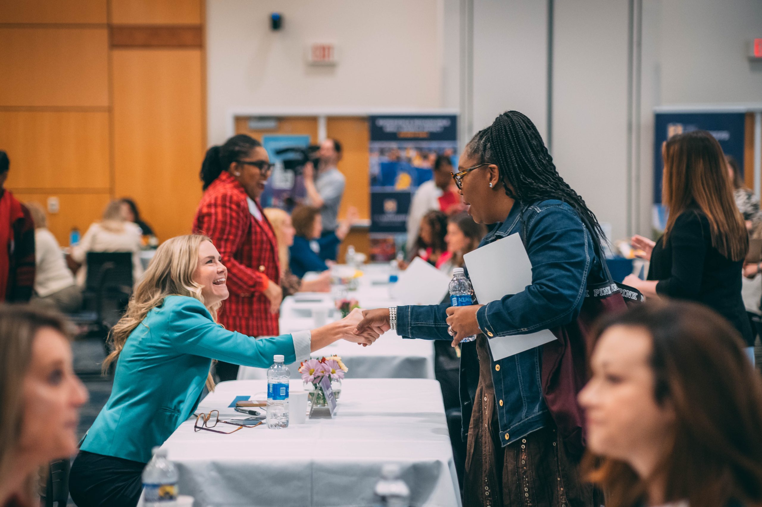 During Mentoring Monday, a mentor and mentee shaking hands after their session.