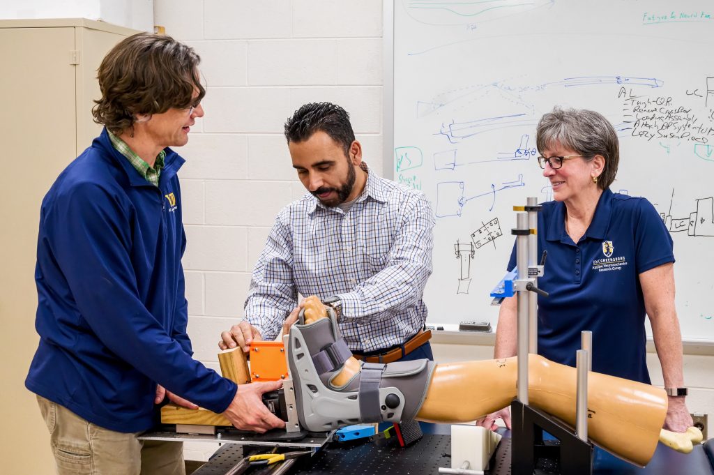 Schmitz, Seyedin, and Shultz discuss next steps for their prototype