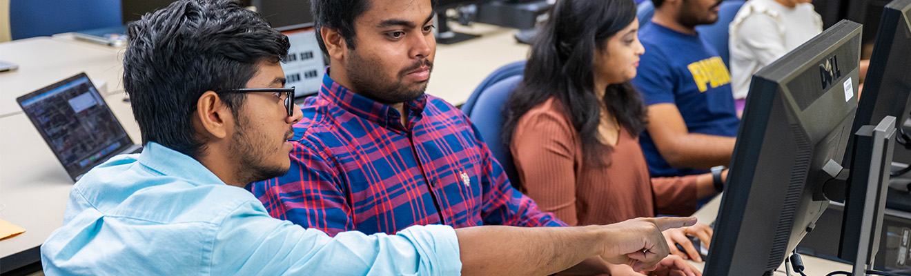 Students work in a computer lab.