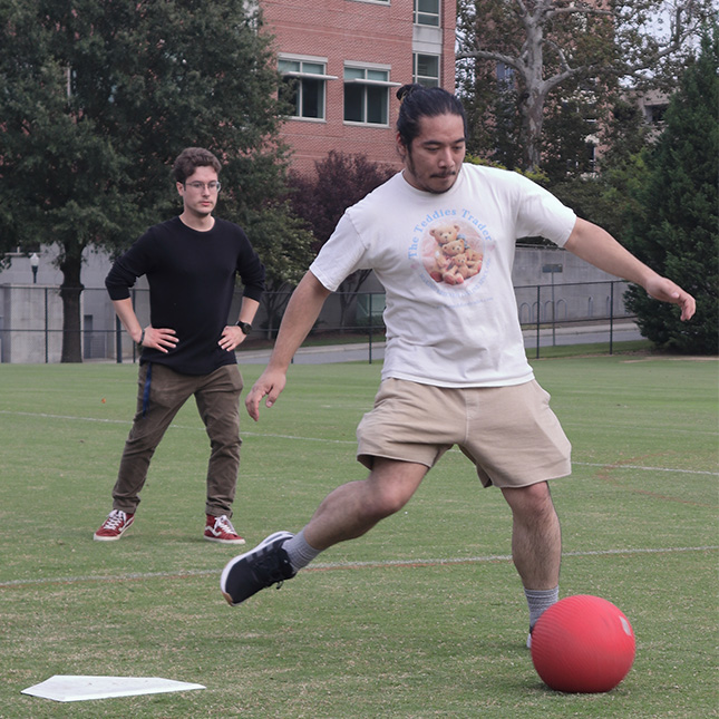Close-up of a kicker in a kickball game.