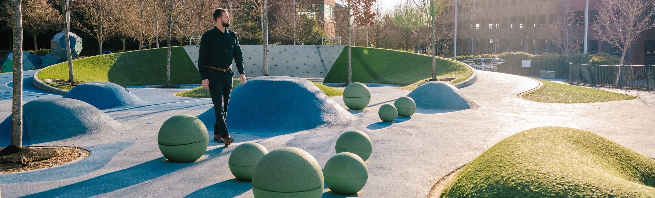 A man walks through a park.