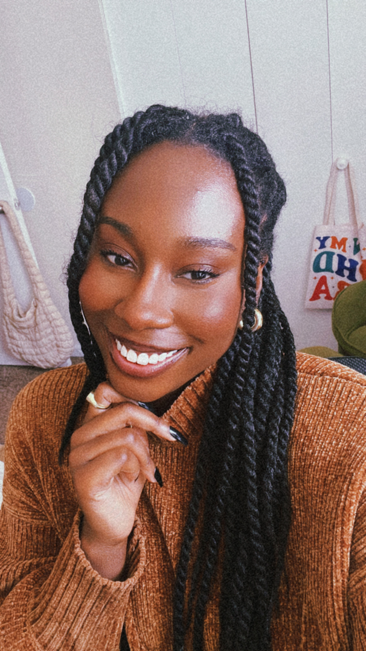headshot of Tyler Bacote with her hand on her chin