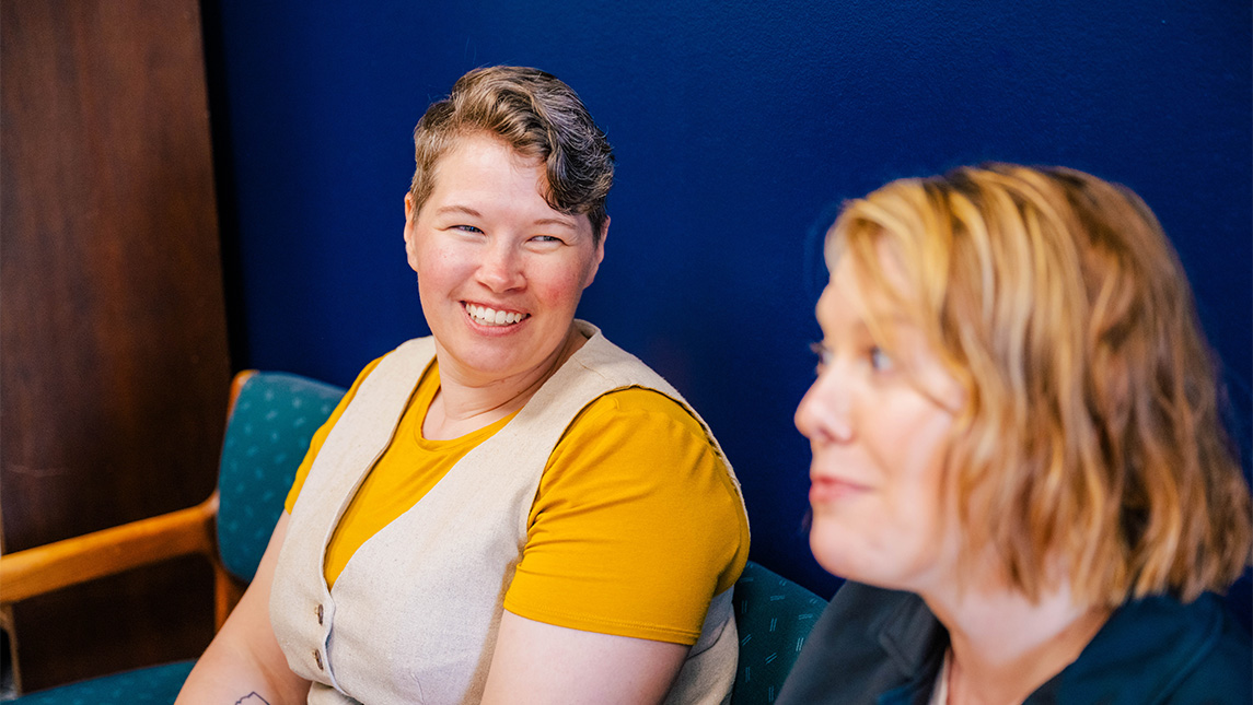 Dr. Lauren Shook smiles while talking to Dr. Heather Adams.