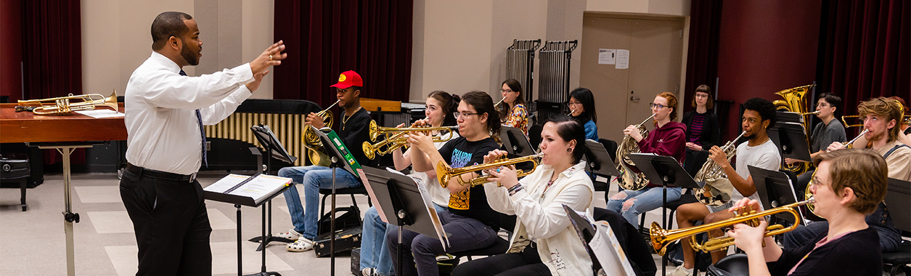Dr. Quinton Parker leads a student orchestra.