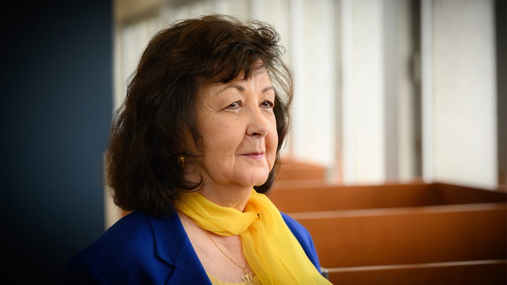 Dr. Nancy Adams standing in a hallway.