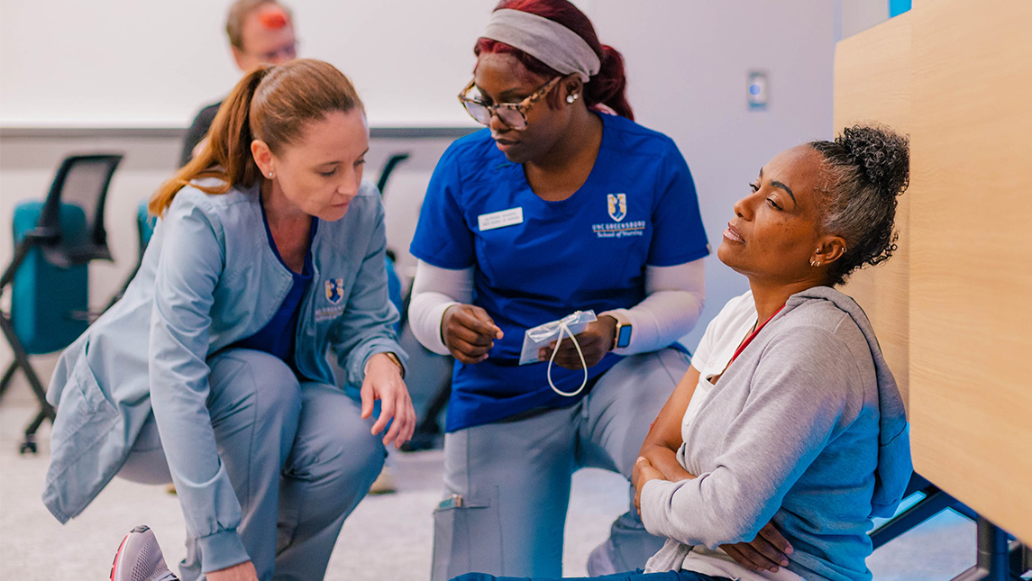 UNCG nursing students check the injuries of an actor.