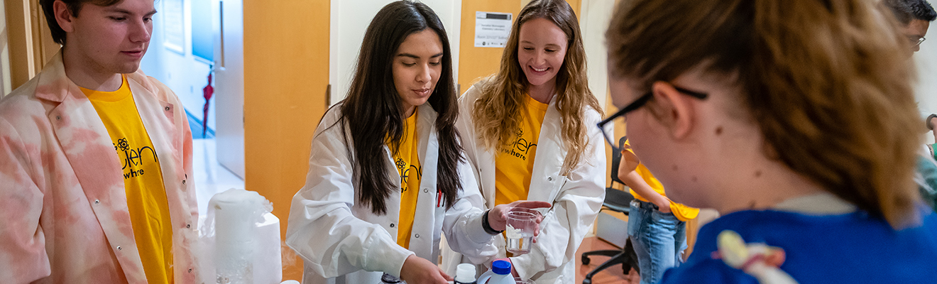 students conduct a science experiment