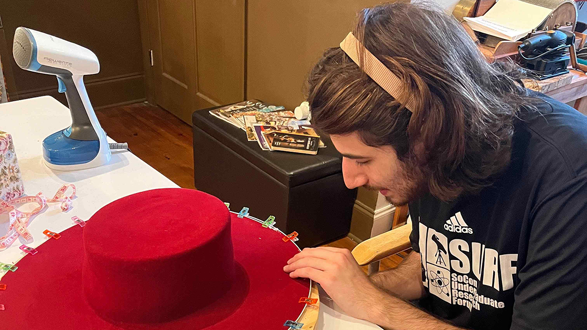 Ethan Divon makes a hat for Pubantz Artist in Residence