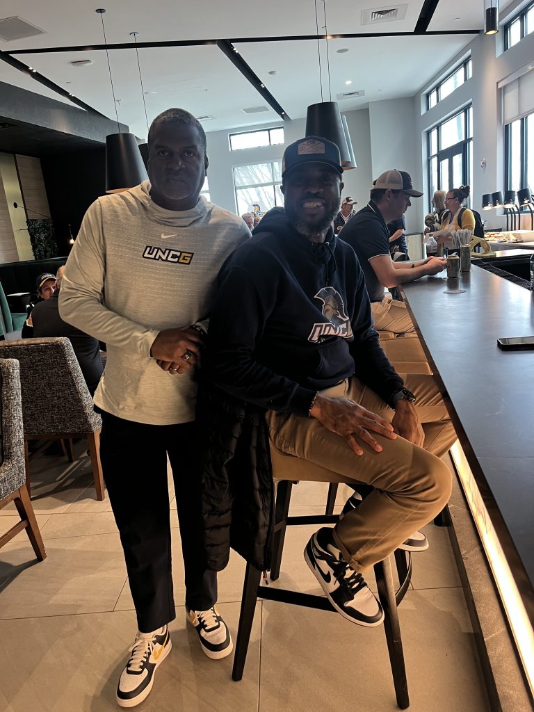 Basketball alumni in the hotel lobby.