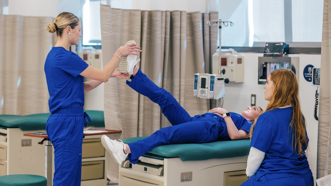 Nursing students learning in the PELMSN Skills Lab at the Nursing Instructional Building.