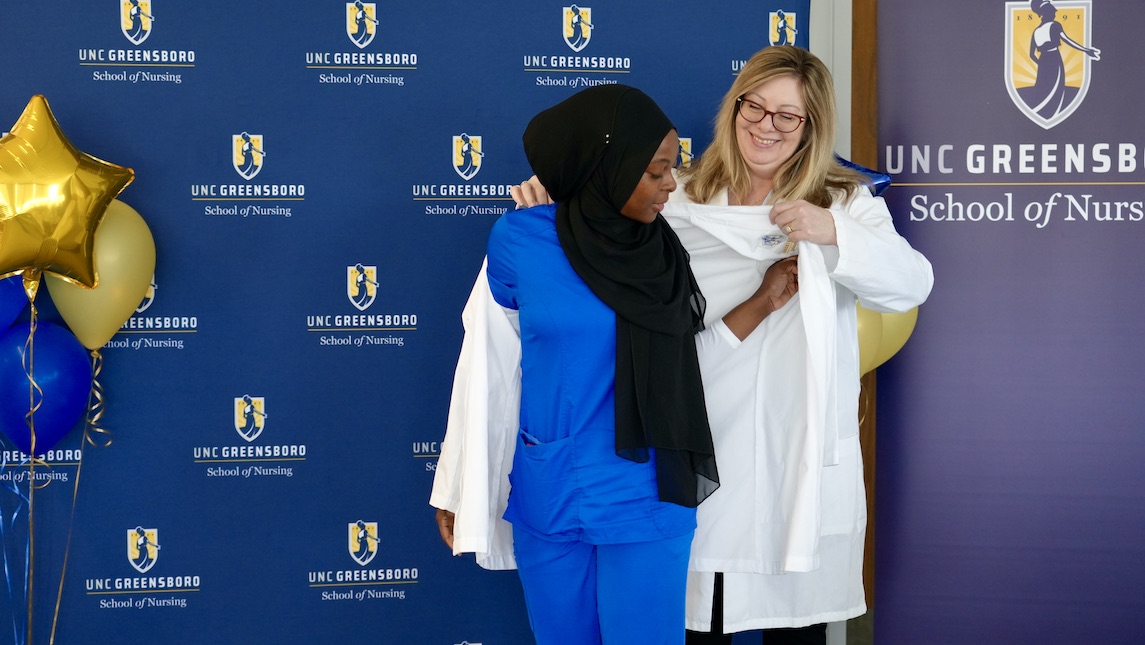 School of Nursing student receiving their white coat.