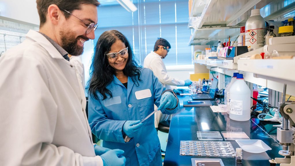 UNCG's Dr. Hemali Rathnayake works in the lab with a student.