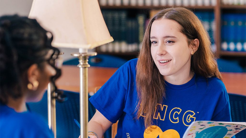 UNCG student Mary Blake Murphy takes notes in the library.