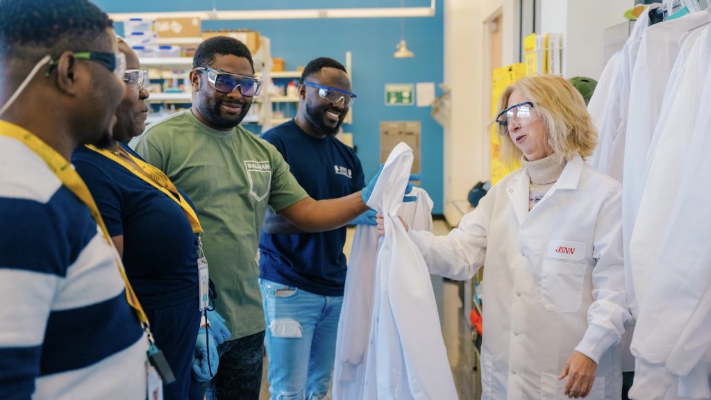 JSNN students receiving lab coats.
