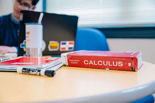Text books on a table in the Math Help Center