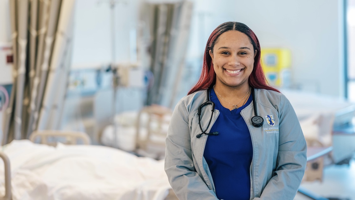 UNCG School of Nursing graduate Jyesha McKinney working in the nursing station.