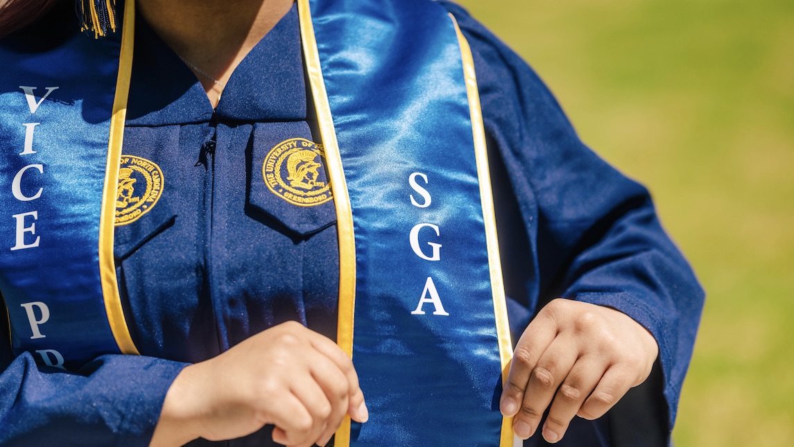 UNCG School of Nursing graduate Jyesha McKinney shows off her SGA sash.
