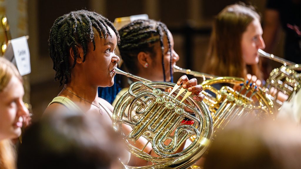 Students perform in an orchestra at UNCG music camp.