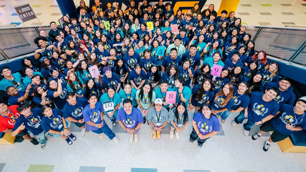 Aerial shot of a large group of high schooler campers at UNCG.