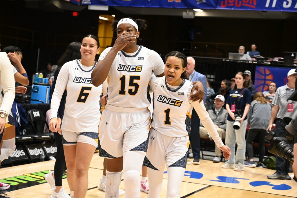 UNCG's Khalis Cain walking onto the basketball court.