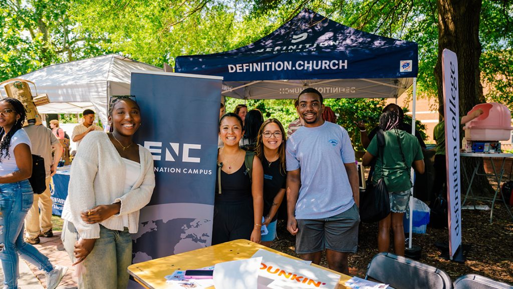 Students pose together at the UNCG Fall Kickoff festival.