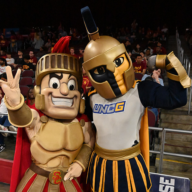 USC Trojan mascot with UNCG Spartan mascot at the 2025 NCAA Women's Tournament.