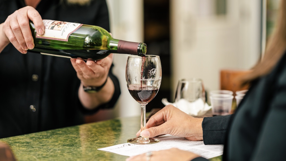 Wine being poured into a wine glass. An agritourism summer assignment with students doing research on the preferences and experiences of consumers at vineyards, and wineries in North Carolina.