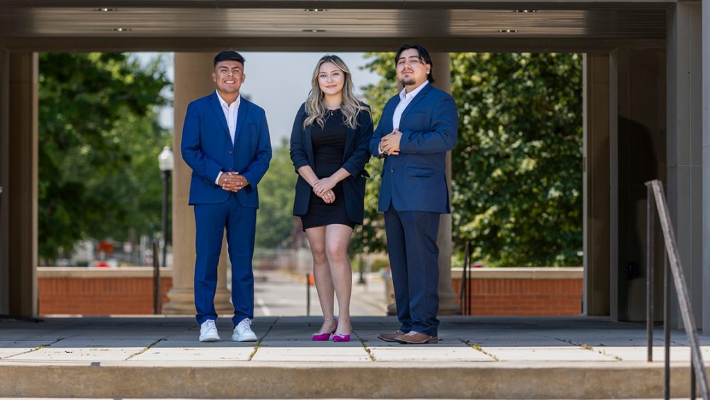 Three ALPFA members posing.
